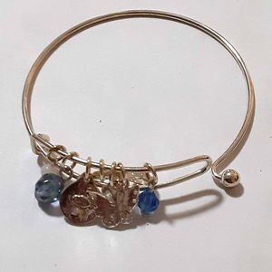 Siiver tone adjustable bracelet strength charm blue charms signed